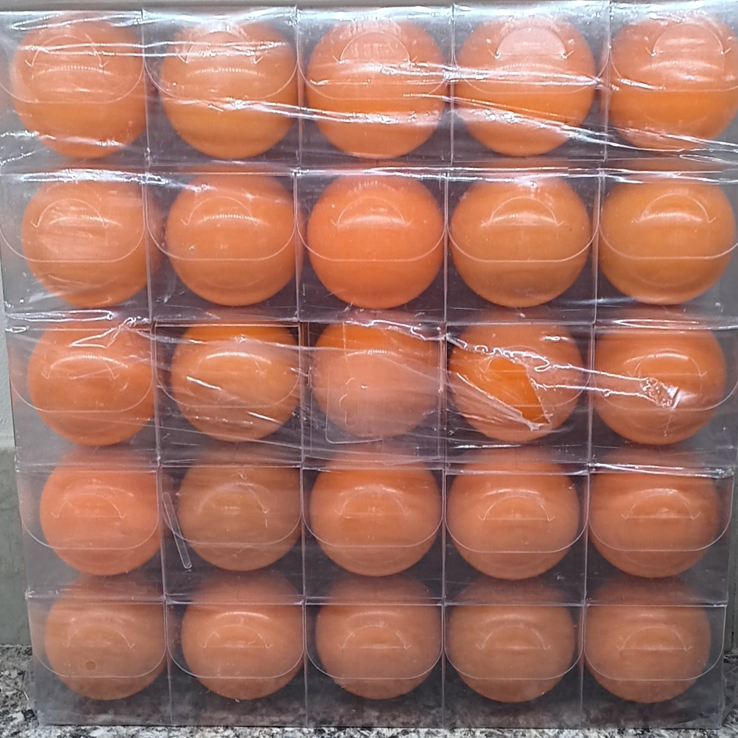 Pack of orange park golf  balls ready to go