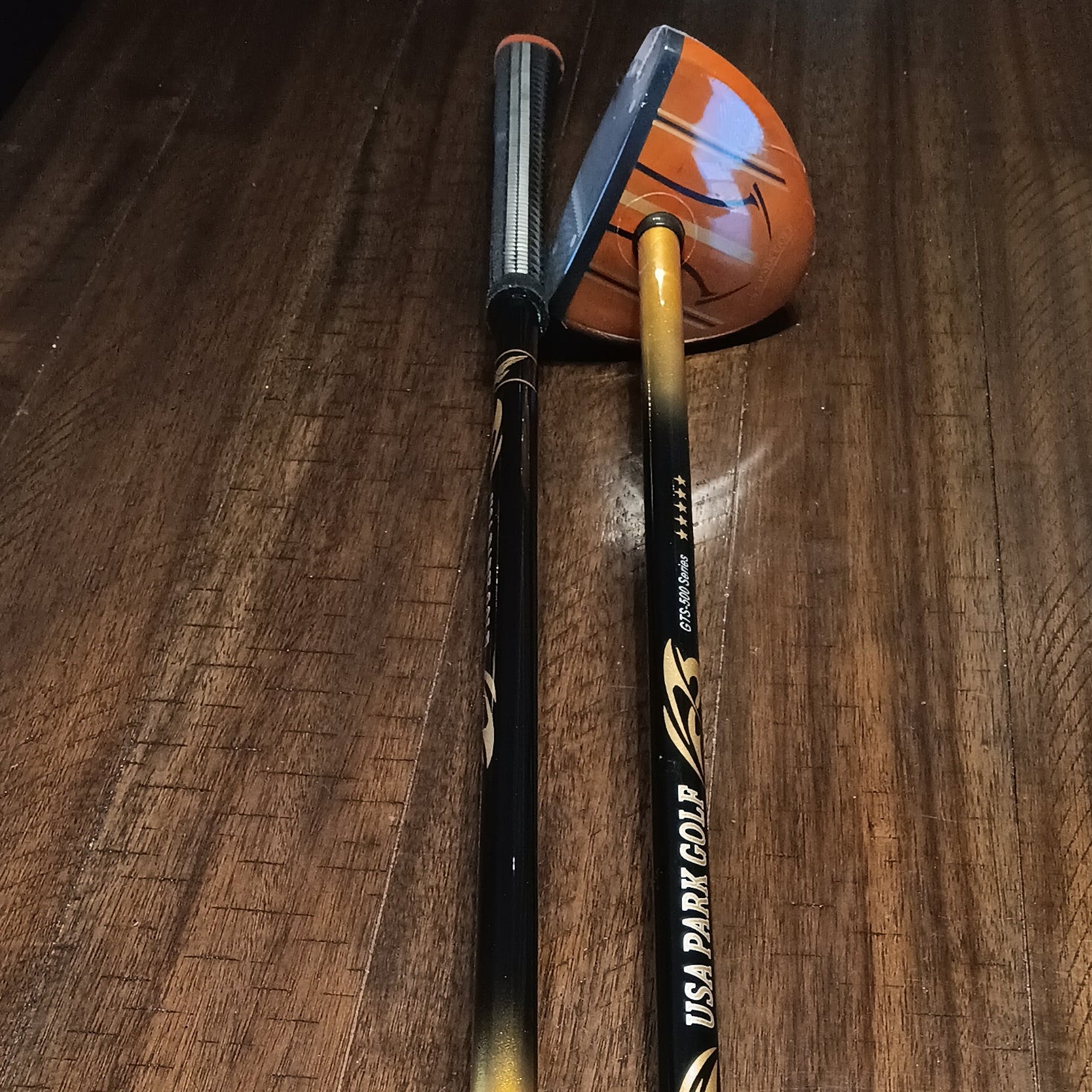 USA Park Golf GTS-500 5 Star -Park Golf club head and shaft on a wooden surface
