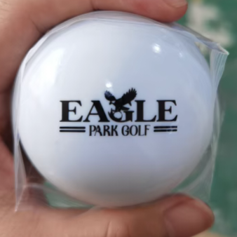 White golf ball with 'Eagle Park Golf' branding.